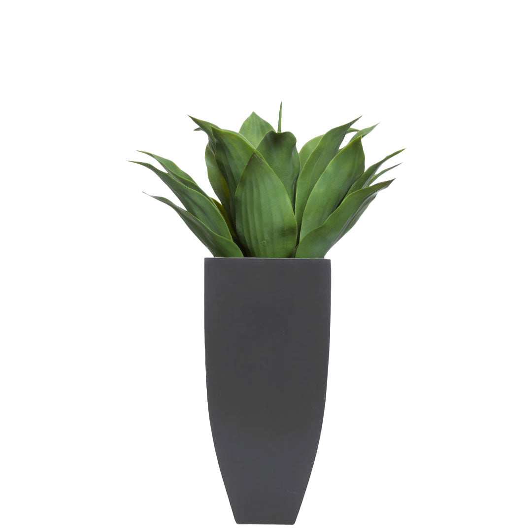 Artificial agave plant with broad green leaves in a tall black modern square planter