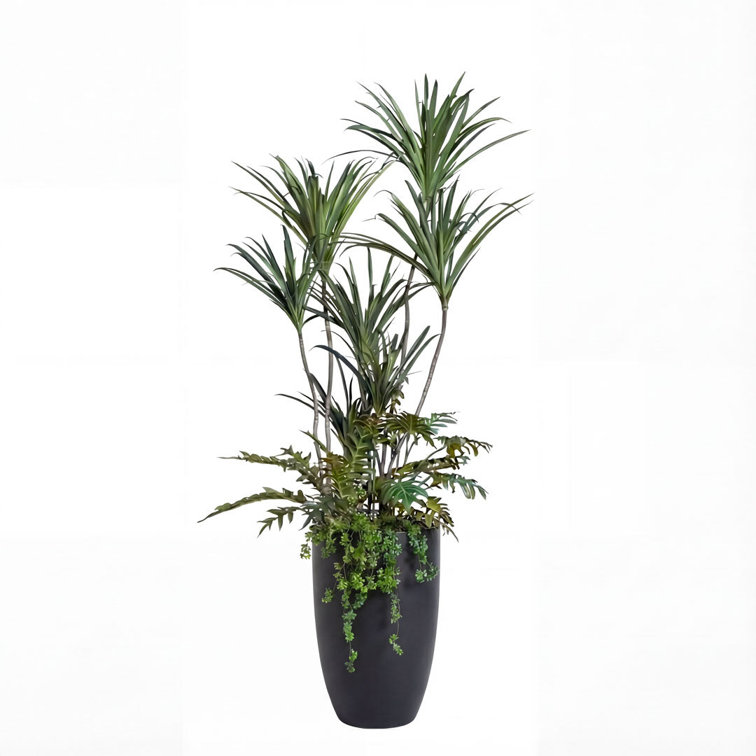 Artificial green palm plant arrangement in sleek black pot on white background